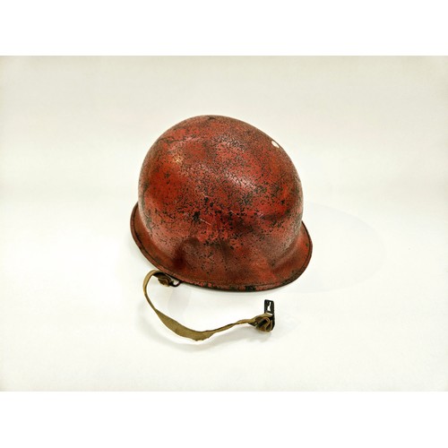 8112 - A post-war US helmet with liner, re-painted in red