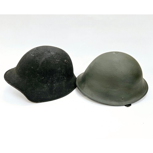 8107 - A Swiss M18/40 helmet together with a post-war British Army helmet (2)