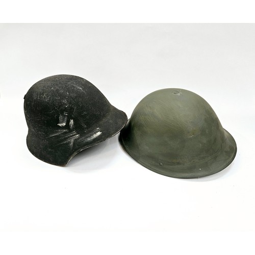 8107 - A Swiss M18/40 helmet together with a post-war British Army helmet (2)