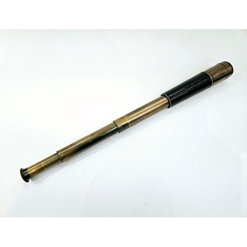 8226 - A vintage leather and brass telescope with brown leather case, no visible maker