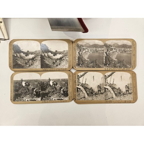 8237 - A stereo viewer together with a quantity of stereo photographs including WWI themes, together with a... 