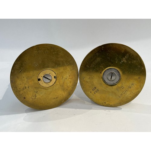 8198 - A pair of WWI Trench Art candlesticks crafted from shells and shell case base, various markings