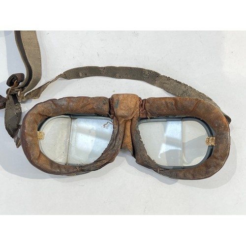 8242 - A pair of WWII flying goggles together with aircraft photograph, ephemera and flying helmet micropho... 