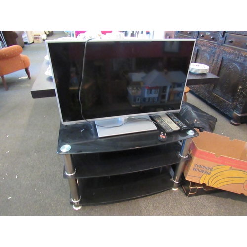 1080 - A Panasonic TV (with remote) and TV stand