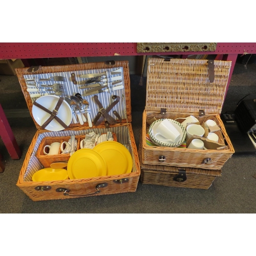 1062 - A large wicker picnic hamper and two smaller examples (3)