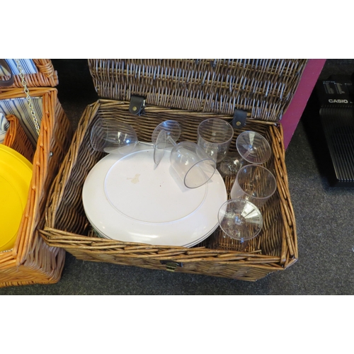 1062 - A large wicker picnic hamper and two smaller examples (3)