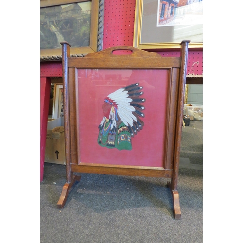 1068 - A 1940's fire screen depicting Native American in headdress