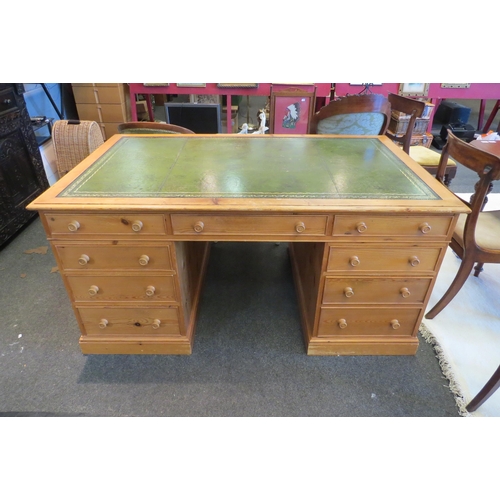 1091 - A Georgian style natural pine twin pedestal desk the tooled leather writing surface over eight drawe... 