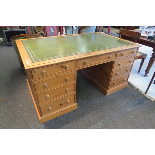 1091 - A Georgian style natural pine twin pedestal desk the tooled leather writing surface over eight drawe... 