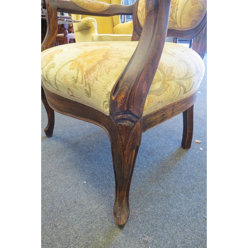 1092 - A 1930's Victorian style spoon-back chair with serpentine seat, floral upholstery