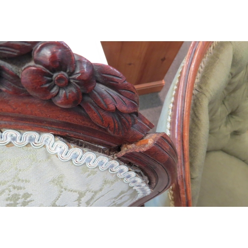 1093 - A 19thc walnut framed button back salon chair and a carved armchair, with backrest repair (2)