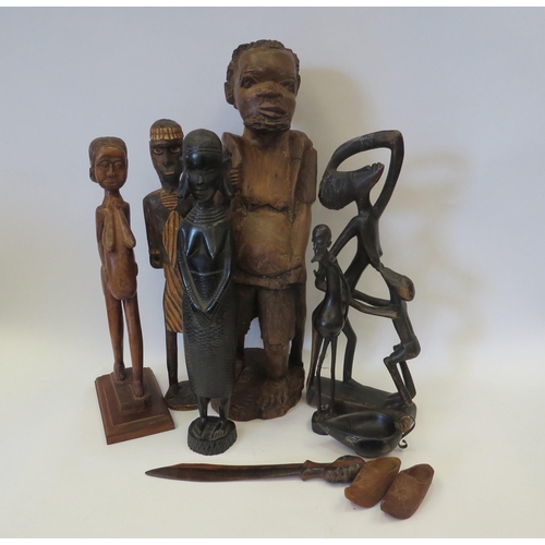 1133 - Six carved wooden African figures to include breastfeeding mother and pot bellied man and other wood... 