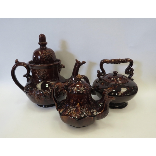 1137 - Three treacle glazed teapots, large example, double spout teapot and another (3 - all  a/f)