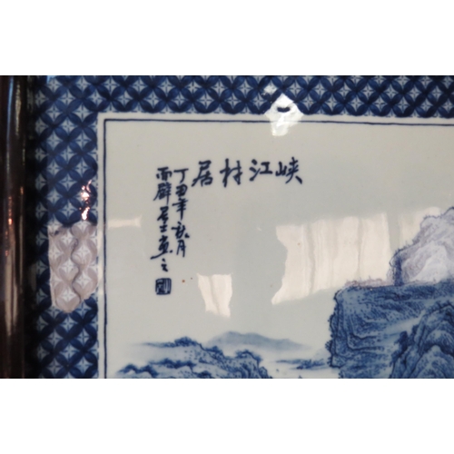 1147 - A triptych of blue and white Chinese porcelain plaques, framed, central plaque 69cm x 44cm total, ot... 