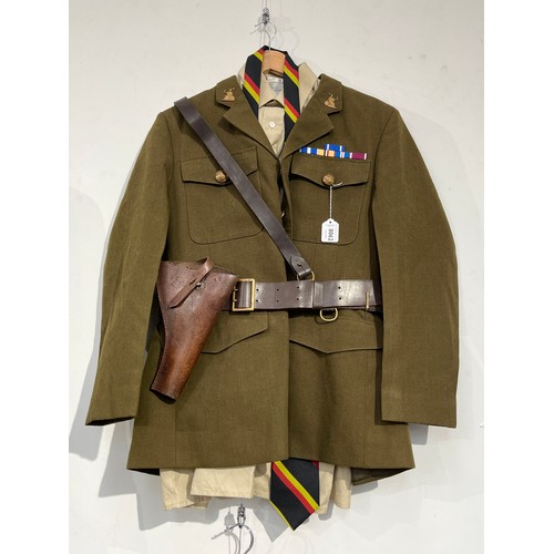 8062 - A post-war British Army Service Dress uniform with Norfolk Regiment insignia, together with an earli... 