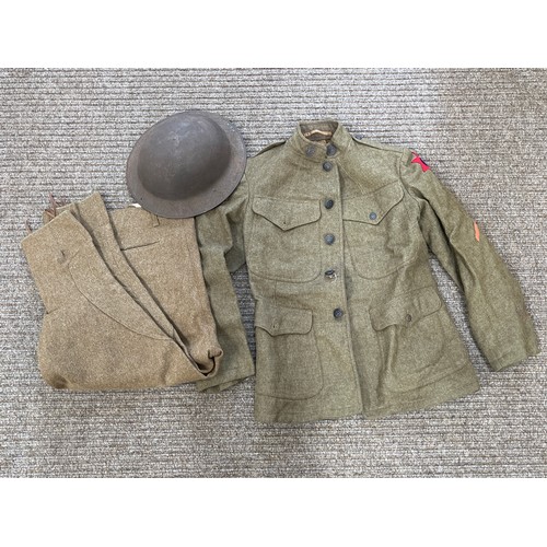 8071 - A WWI US Brodie helmet together with WWI US soldier's service jacket and breeches  (C)