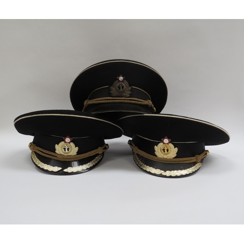 8122 - Three USSR Russian Soviet Naval officer's peaked visor caps, two high ranking with leaves to visor, ... 