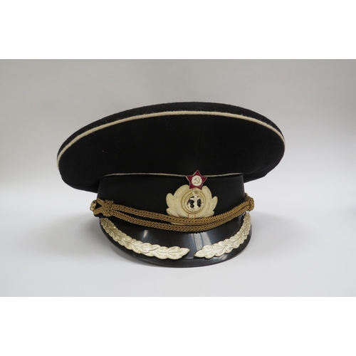 8122 - Three USSR Russian Soviet Naval officer's peaked visor caps, two high ranking with leaves to visor, ... 