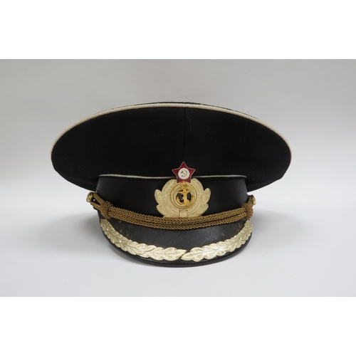 8122 - Three USSR Russian Soviet Naval officer's peaked visor caps, two high ranking with leaves to visor, ... 