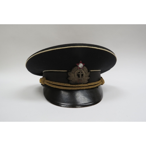 8122 - Three USSR Russian Soviet Naval officer's peaked visor caps, two high ranking with leaves to visor, ... 