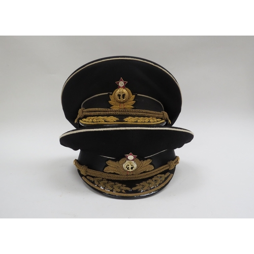 8124 - Two USSR Russian Soviet Naval officer's peaked visor caps, both high-ranking and circa 1950's-60s, e... 