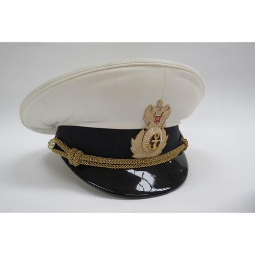 8125 - Three Russian Federation Naval officer's peaked visor caps, two white with black band, the other bla... 