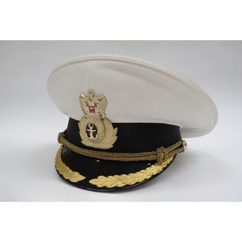 8125 - Three Russian Federation Naval officer's peaked visor caps, two white with black band, the other bla... 