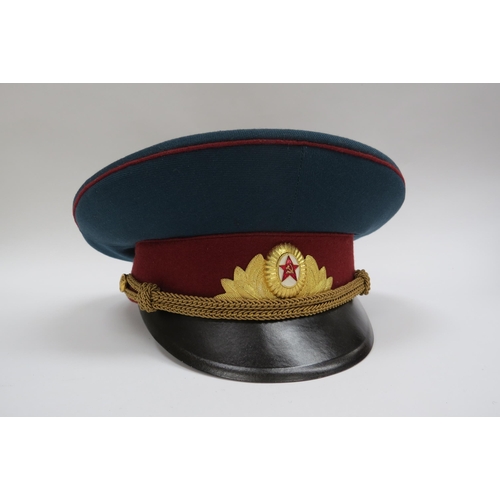 8127 - Four USSR Russian Soviet peaked visor caps including Army Officer (dark green with red band and red ... 