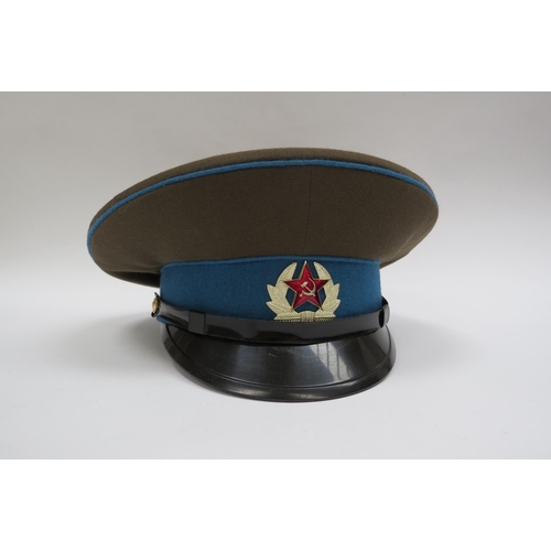 8128 - Four USSR Russian Soviet peaked visor caps: Border Guard (green with red piping), Air Force (blue wi... 