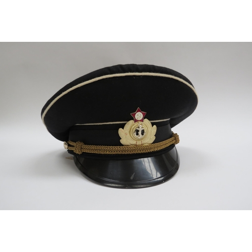 8135 - A quantity of USSR Russian Soviet peaked headwear including two Naval officer’s caps, two sailor’s h... 