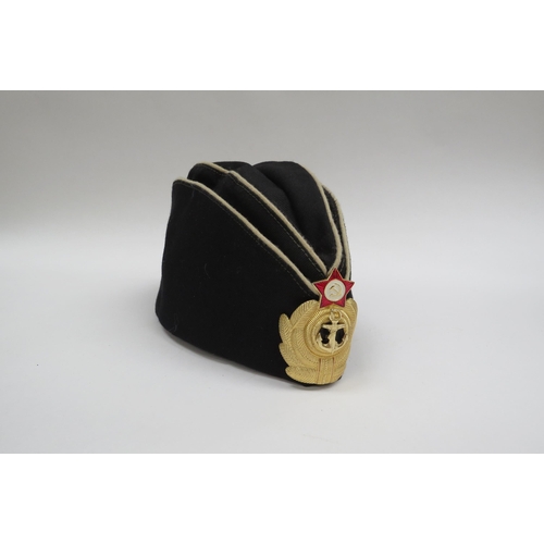 8135 - A quantity of USSR Russian Soviet peaked headwear including two Naval officer’s caps, two sailor’s h... 