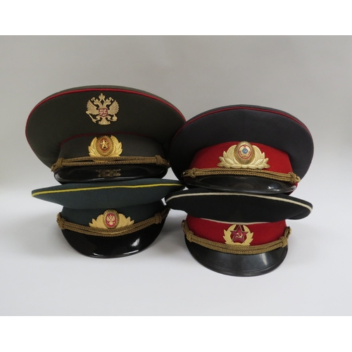 8136 - Four Russian peaked visor caps: Two USSR Soviet era officer's and two Russian Federation (one with r... 