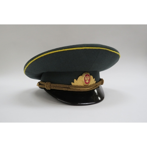 8136 - Four Russian peaked visor caps: Two USSR Soviet era officer's and two Russian Federation (one with r... 