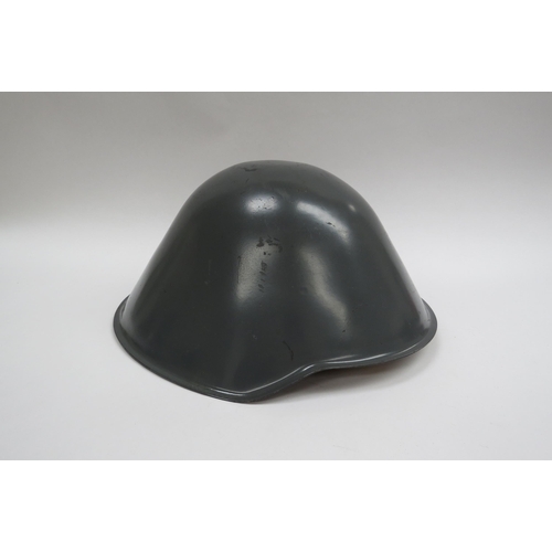 8141 - An East German helmet, a French M78 F1 helmet, together with three others (5)