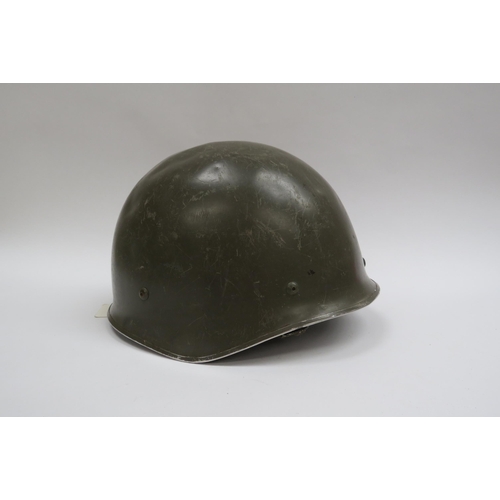 8141 - An East German helmet, a French M78 F1 helmet, together with three others (5)