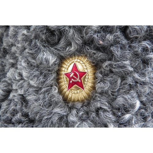 8142 - A USSR Russian Soviet Papakha astrakhan fur hat with pink top, gold trim, bearing gilt and red ename... 