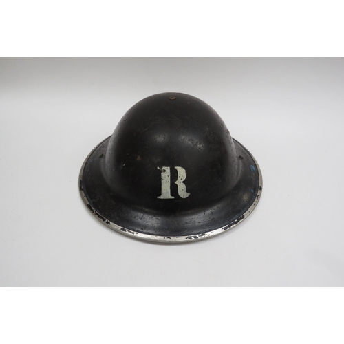 8144 - A WWII British Home Front Rescue Party Steel Helmet, black with stencilled white “R” to the centre o... 