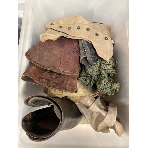 8079 - A box of miscellaneous militaria including 1944 dated mosquito spats, leather boots, buskins, webbin... 