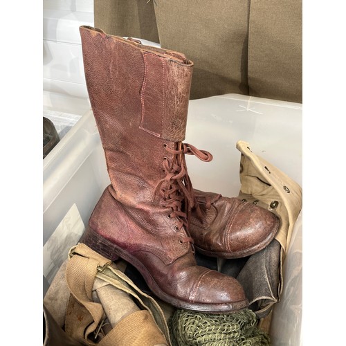 8079 - A box of miscellaneous militaria including 1944 dated mosquito spats, leather boots, buskins, webbin... 