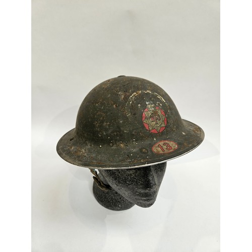 8104 - A WWII British helmet, the shell dated 1939 and liner 1938, with traces of original 'AFS IPSWICH' pa... 