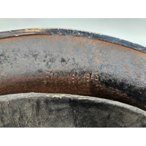 8103 - A WWII British Home Front steel helmet, black with stencilled indistinct lettering in white PFR / PE... 