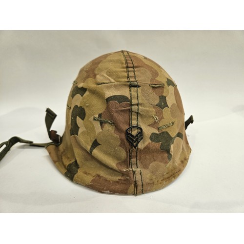 8102 - A US Vietnam War era helmet with liner and camouflage cover