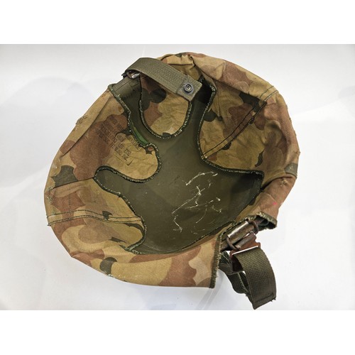 8102 - A US Vietnam War era helmet with liner and camouflage cover