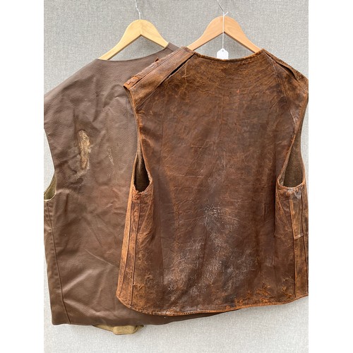 8153 - A WWII 1945 dated No. 2 leather jerkin, size No. 1, some wear, together with another dated 1961 (2)