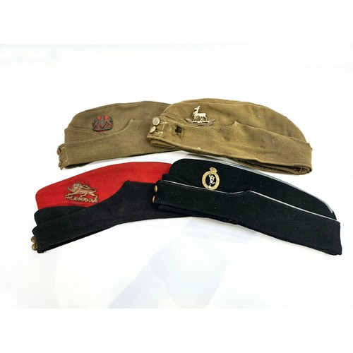 8108 - Four mid century forage caps including Royal Warwickshire, Royal Corps of Signals and Kings Own Regi... 