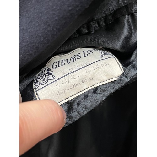 8155 - A WWII Royal Naval Great Coat dated 1940 to label, together with a battledress jacket (mothed) dated... 