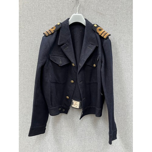 8155 - A WWII Royal Naval Great Coat dated 1940 to label, together with a battledress jacket (mothed) dated... 