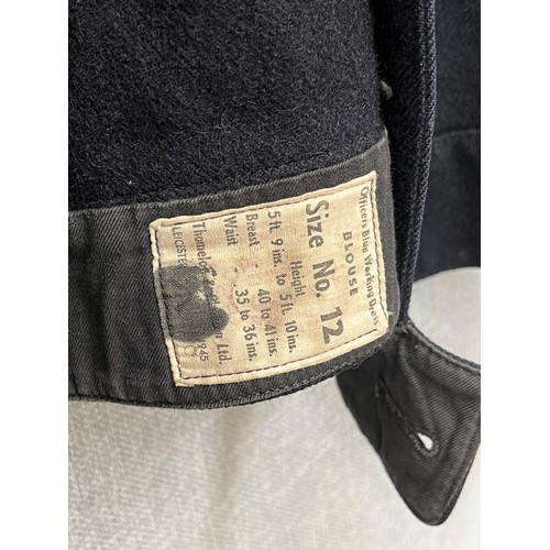 8155 - A WWII Royal Naval Great Coat dated 1940 to label, together with a battledress jacket (mothed) dated... 