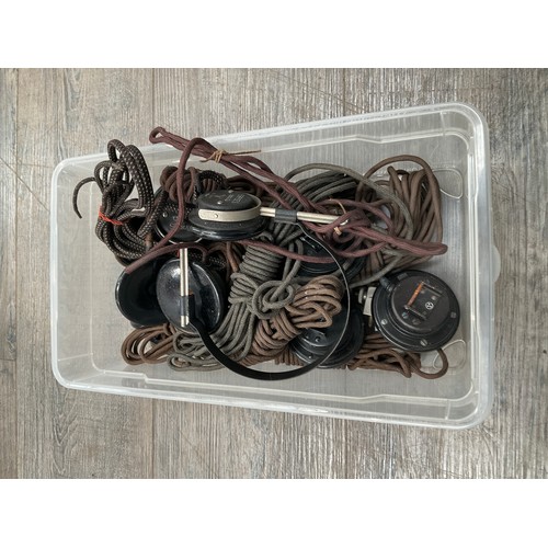 8361 - A large collection of WWII German earphones, some stamped with Waffen markings