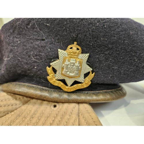 8111 - A box of military hats including officer's peaked dress hats, berets and side hats  (C)